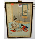 A framed and coloured Japanese woodblock print, depicting mother and child