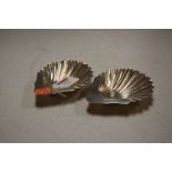 A pair of Edwardian silver scallop shaped butter dishes, Mappin & Webb, Sheffield 1904, 4.5oz