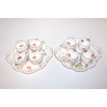 A set of four Coalport strawberry pattern cups and covers on stand, together with one other matching