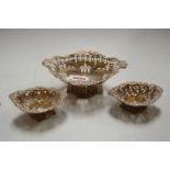 A late Victorian silver bonbon dish, of pierced oval form; together with a similar smaller pair,