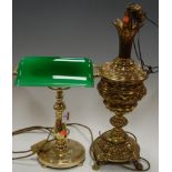 A lacquered brass pedestal desk lamp having adjustable green glass shade together with one other