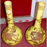 A pair of large 19th century Chinese earthenware yellow ground bottle vases, having Greek Key topped