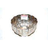 A Victorian silver bowl, of squat melon form, each panel embossed with animals and insects amidst