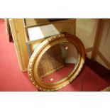 A gilt framed and bevelled oval wall mirror; assorted prints etc (5)