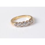 An 18ct five stone diamond ring, the five graduated round brilliant cut diamonds, total weight of