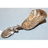 A Victorian silver caddy spoon, the bowl embossed with leaves and berries, having further leaf
