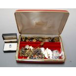 A leather clad jewellery box and contents to include various gold plated necklaces, beaded necklaces