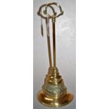 A Victorian brass and cast iron door stop, height 43cm