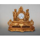 A late 19th century French gilt metal cased mantel clock, having enamelled dial with Roman