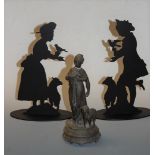 An early 20th century Spelter model of a shepherdess with attendant sheep, h.22cm; together with a