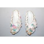 A pair of Chinese glazed stoneware wall pockets, each modelled as a leaf and heightened in gilt,
