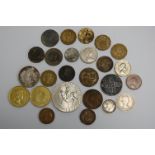 A small collection of assorted coins and tokens, to include George III spade guinea token