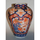 A large 19th century Japanese vase, of octagonal baluster form, typically decorated in the Imari