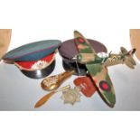 A small collection of miscellaneous items, to include a model of Spitfire MkI, Russian peaked cap,