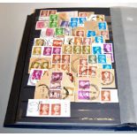 A stamp album and contents, mainly being Elizabeth II examples; together with various other stamp