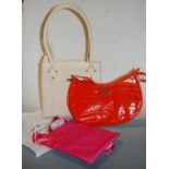 A ladies Osprey of London cream leather handbag together with one other orange leather example,