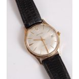 A gentleman's 18ct gold Automatic wristwatch by Garrard, the signed round dial with gold baton
