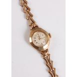 A lady's 9ct Rotary wristwatch, the signed round dial with Arabic numerals, gold case stamped 375,