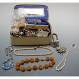 A box of assorted costume jewellery including faux butterscotch amber necklace etc