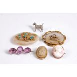 A small quantity of jewellery to include a three stone amethyst brooch, a shell cameo brooch, a lava