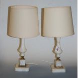 A pair of onyx and brass mounted table lamps with shades, height 48cm including shades