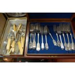 A 1920s mahogany cutlery canteen, containing three trays of mixed loose silver plated flatware;