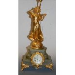 A 19th century French onyx and gilt metal mounted mantel clock having a painted enamel dial with
