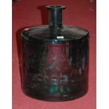 A large green glass carboy