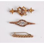 A 9ct bar brooch set with a heart and a bird, a 9ct blue stone and seed pearl brooch and an unmarked