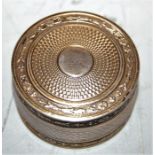 A 19th century engine turned silver pill-box, of cylindrical form, having gilt-washed interior, dia.