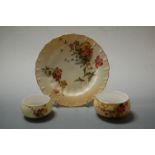 A Royal Worcester blush ivory tea plate, together with two table salts, each with puce backstamps,