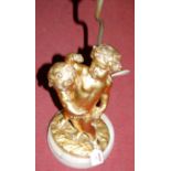 A gilt metal cherub figural table lamp