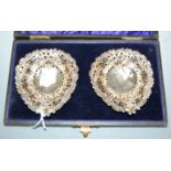 A pair of circa 1900 silver bonbon dishes, of pierced teardrop shape, Chester assays, housed in a