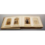 A 19th century leather bound photograph album, the cover having inset porcelain plaque hand-