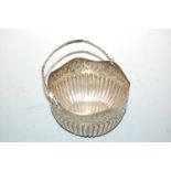 A circa 1900 continental silver basket having a wavy rim with embossed decoration to gadrooned base,