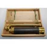 An early 20th century brass and leather clad four-drawer telescope, with lacquered brass stand,