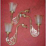 A set of three early 20th century lacquered brass single sconce wall light fittings, each with