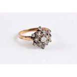 A 9ct diamond cluster ring, the central round brilliant cut diamonds surrounded by single cut
