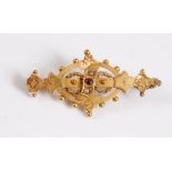 A 9ct gold, garnet and seed pearl bar brooch, hallmarked to reverse, Birmingham 1894, 41mm long, (