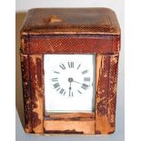 An early 20th century lacquered brass cased carriage clock, having enamelled dial with Roman