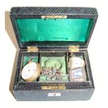 An early 20th century green leather clad jewellery box and contents, to include lady's silver