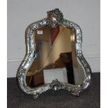 A large late 19th century French silver plated easel dressing table mirror having a shaped