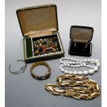 A large collection of miscellaneous costume jewellery to include gold plated necklace, beaded