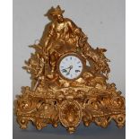 A late 19th century gilt metal cased mantel clock having a convex enamel dial with Roman numerals
