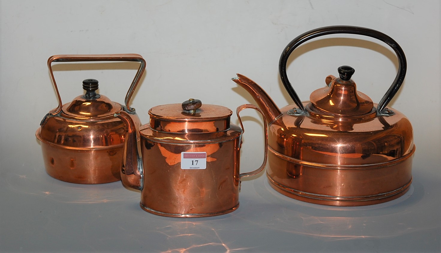 An early 20th century copper quick-boiling kettle; together with two other copper kettles (3)