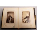 A Victorian leather bound and brass mounted photograph album and contents, mainly being family