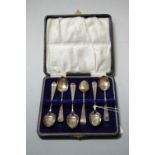 A cased set of six silver teaspoons, with bright cut engraved decoration, Birmingham 1903, case w.