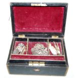 A Victorian black leather clad jewellery box and contents, to include silver horseshoe brooch,