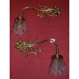 A pair of Art Nouveau style lacquered brass single sconce wall light fittings, each having a pinched