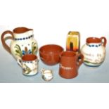 A quantity of Devon mottowares, to include cream jugs